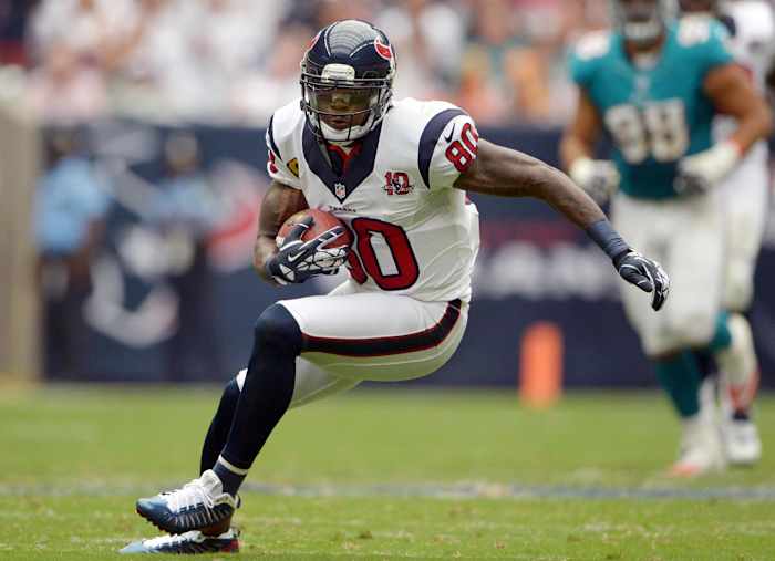 Texans receiver Andre Johnson (80) catches a pass against the Miami Dolphins at Reliant Stadium. The Texans defeated the Dolphins 30-10.